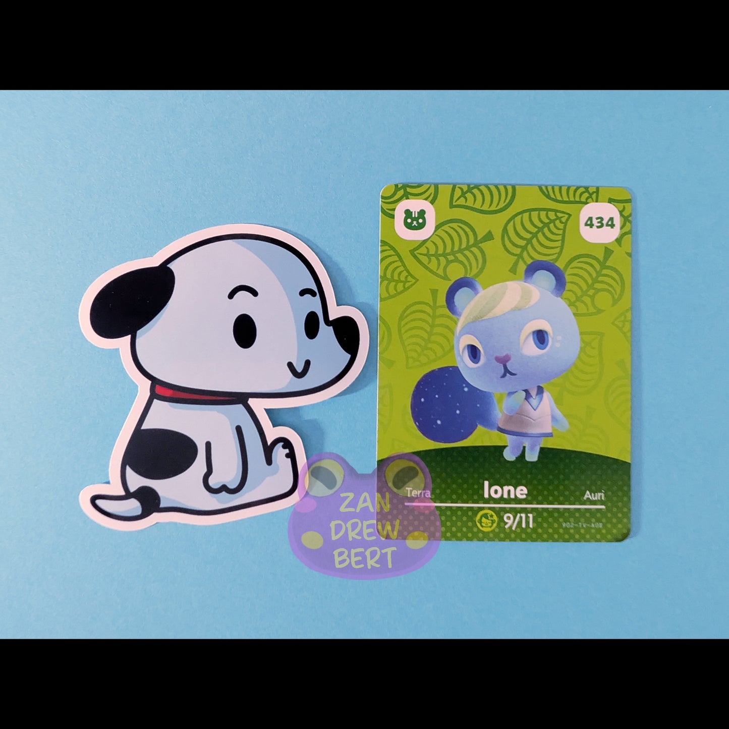 Snoopy sticker played next to Animal crossing Amiibo Card for size reference. 